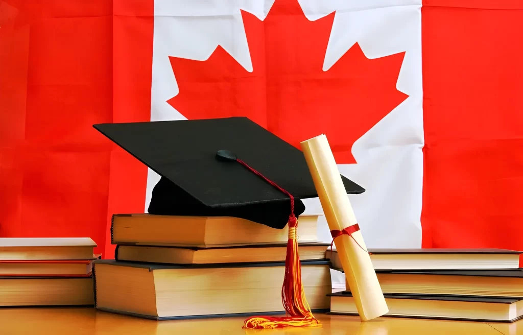 خلفية الصورة هو علم كندا وامامه يوجد شهادة و قبعة التخرج بالاضافة الى 9 كتب