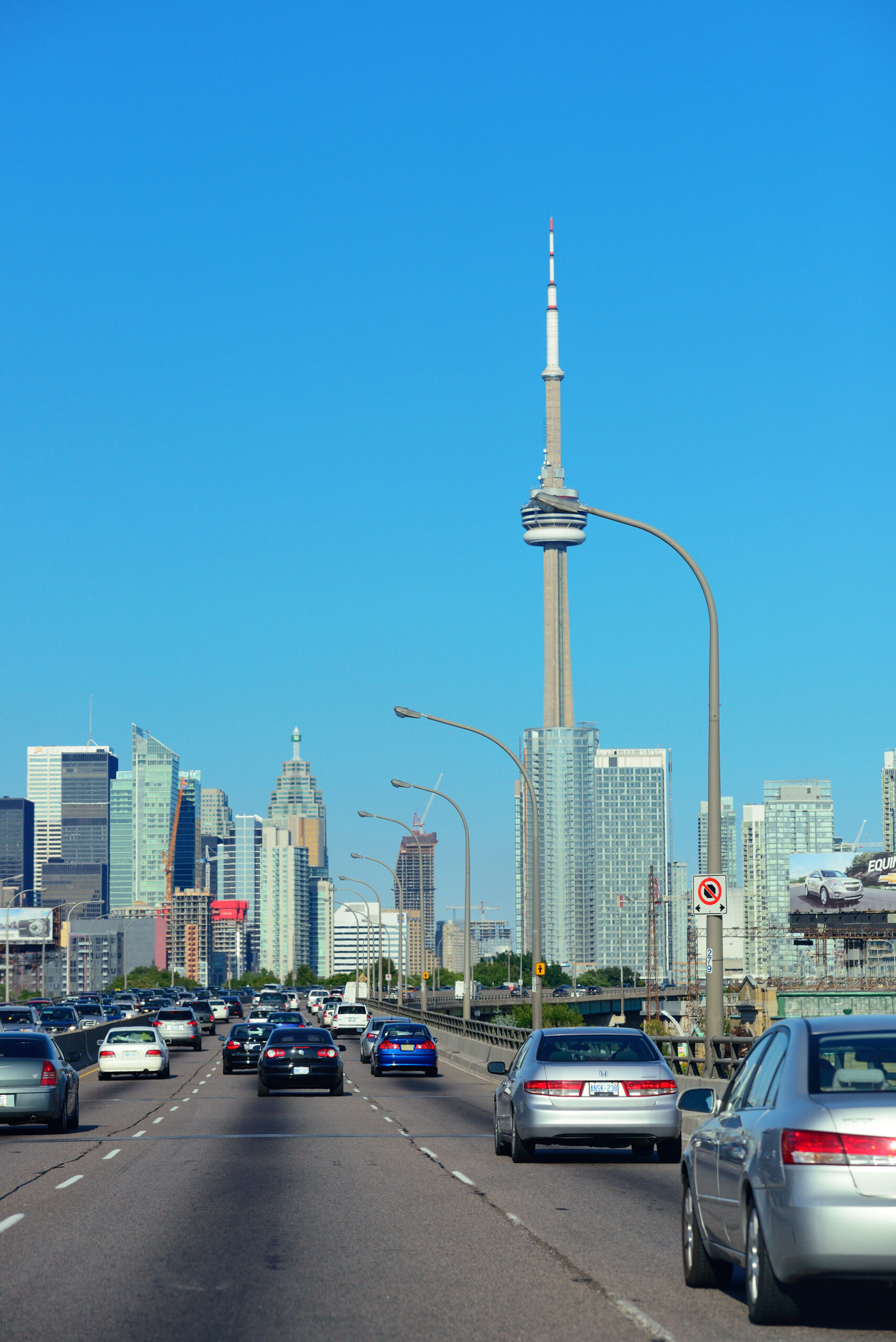 A street in the city with many cars driving on it