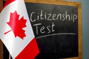 Flag of Canada and Citizenship Test on the chalkboard.