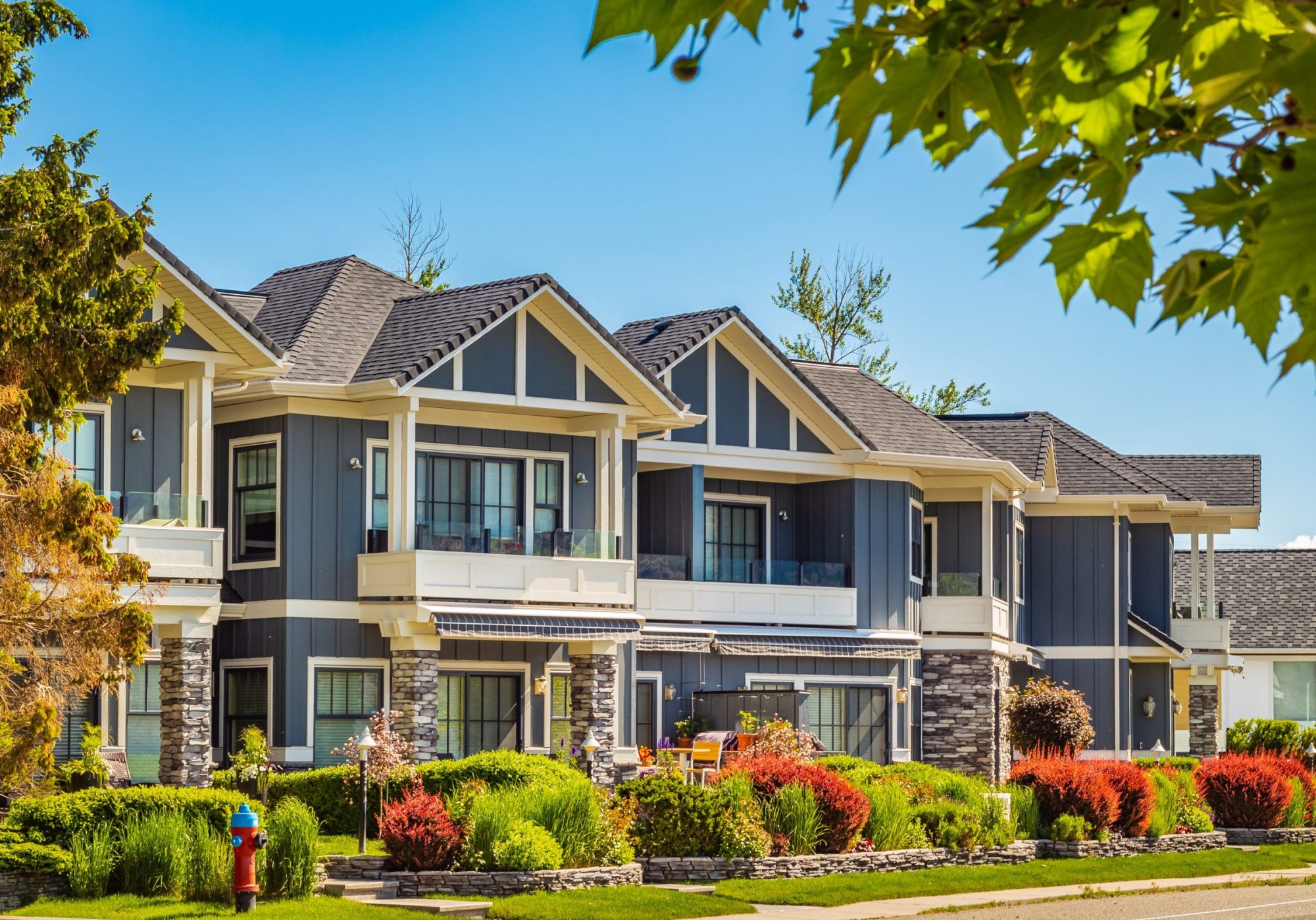 Neighborhood modern houses building in BC, Canada. Canadian modern residential architecture, low-rise