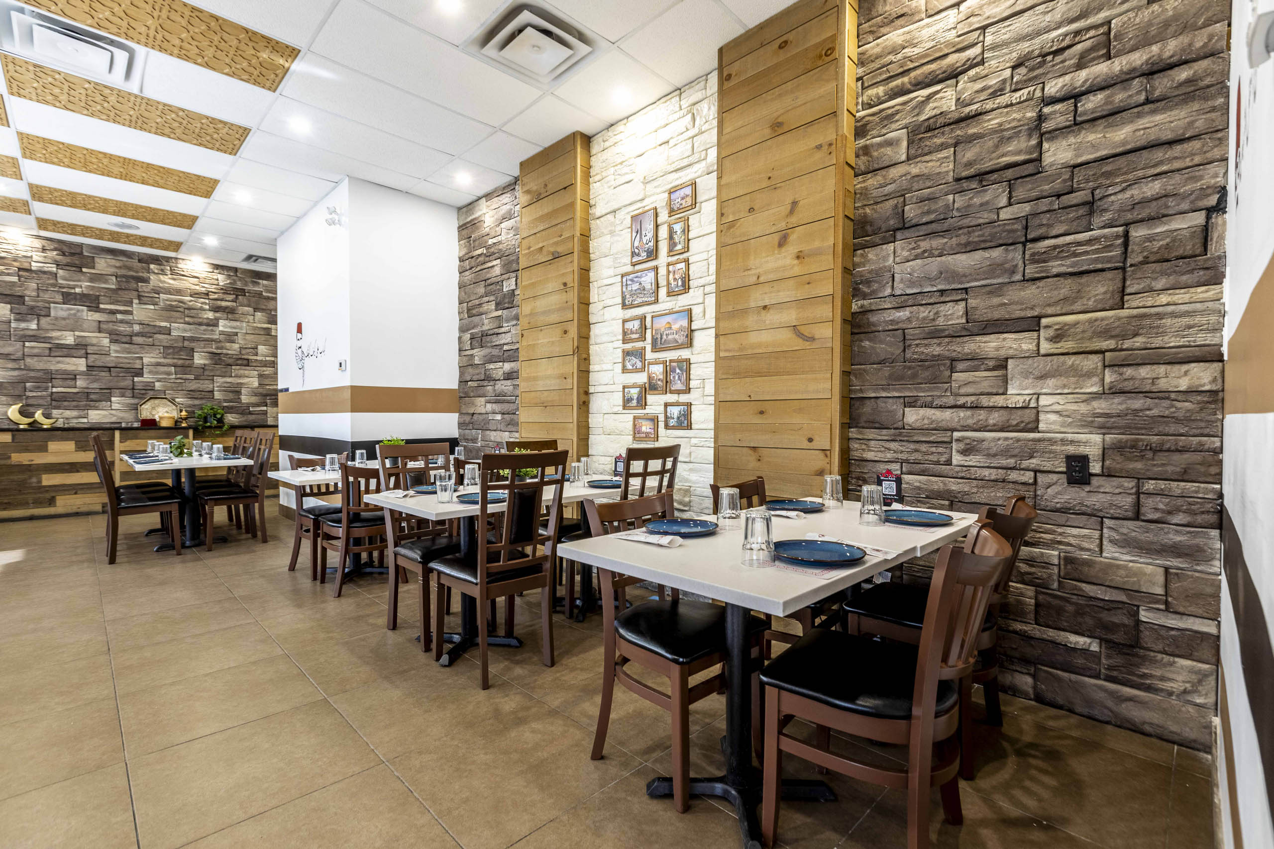 Inside a restaurant featuring an attractive decor combining wood and stone.