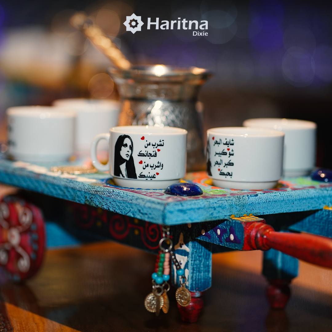 A tray containing an Arabic coffee pot and a cup printed with a picture of the singer Fairuz