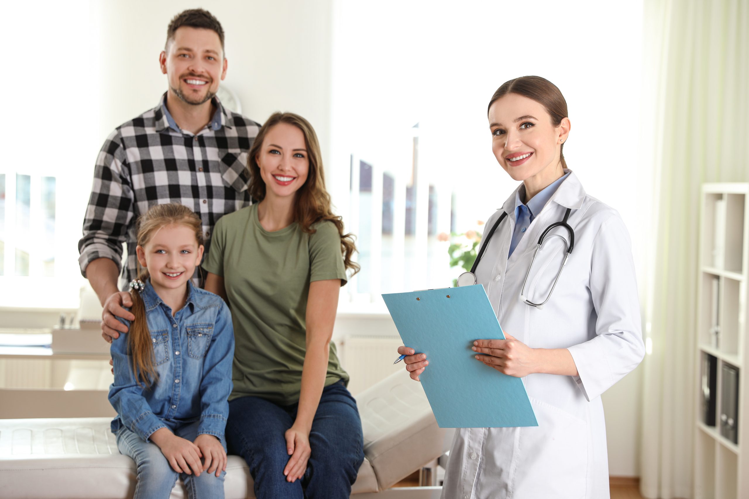 Doctor meeting a family in an examination room